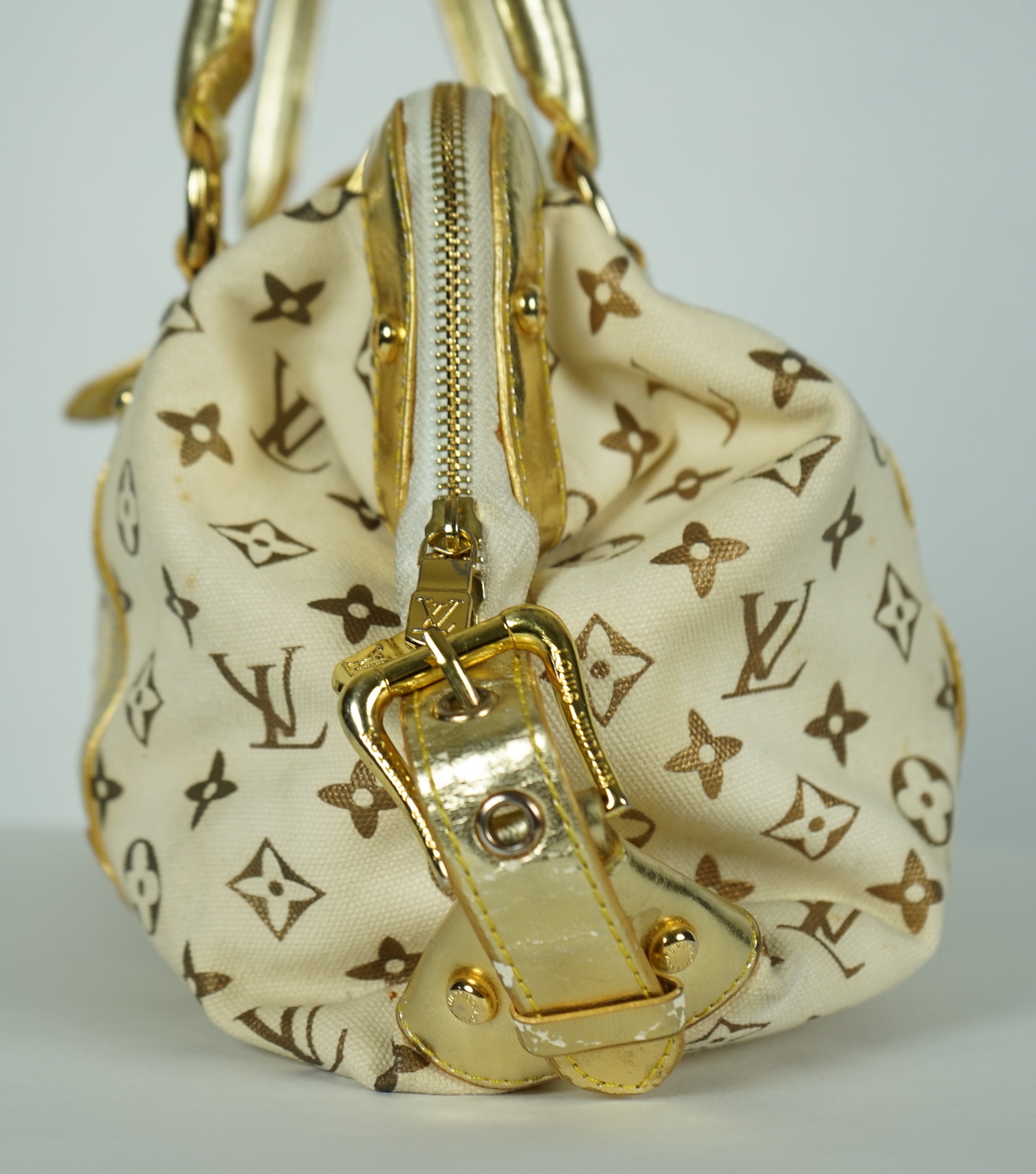 A vintage Louis Vuitton Theda beige and brown Monogram bag